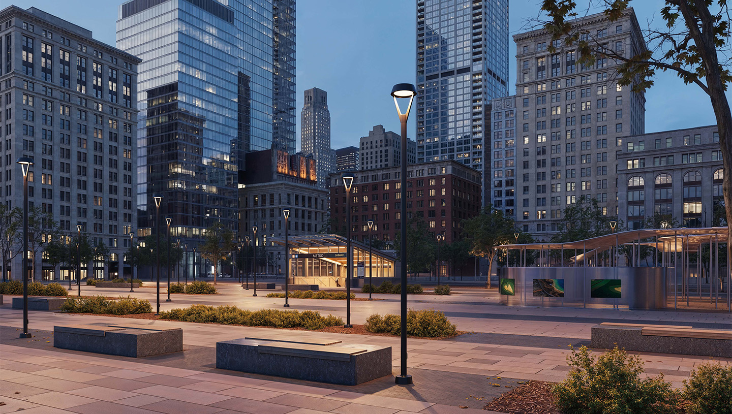 Luminis Clermont pole lights illuminate an urban plaza at dusk