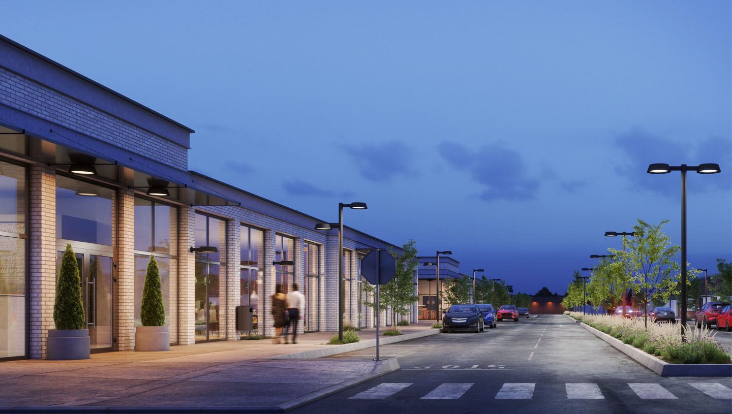 Clermont lighting fixtures illuminate pathways and street at dusk