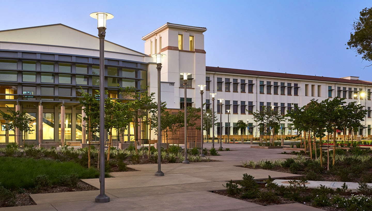 Eclipse luminaires light high school exterior at dusk