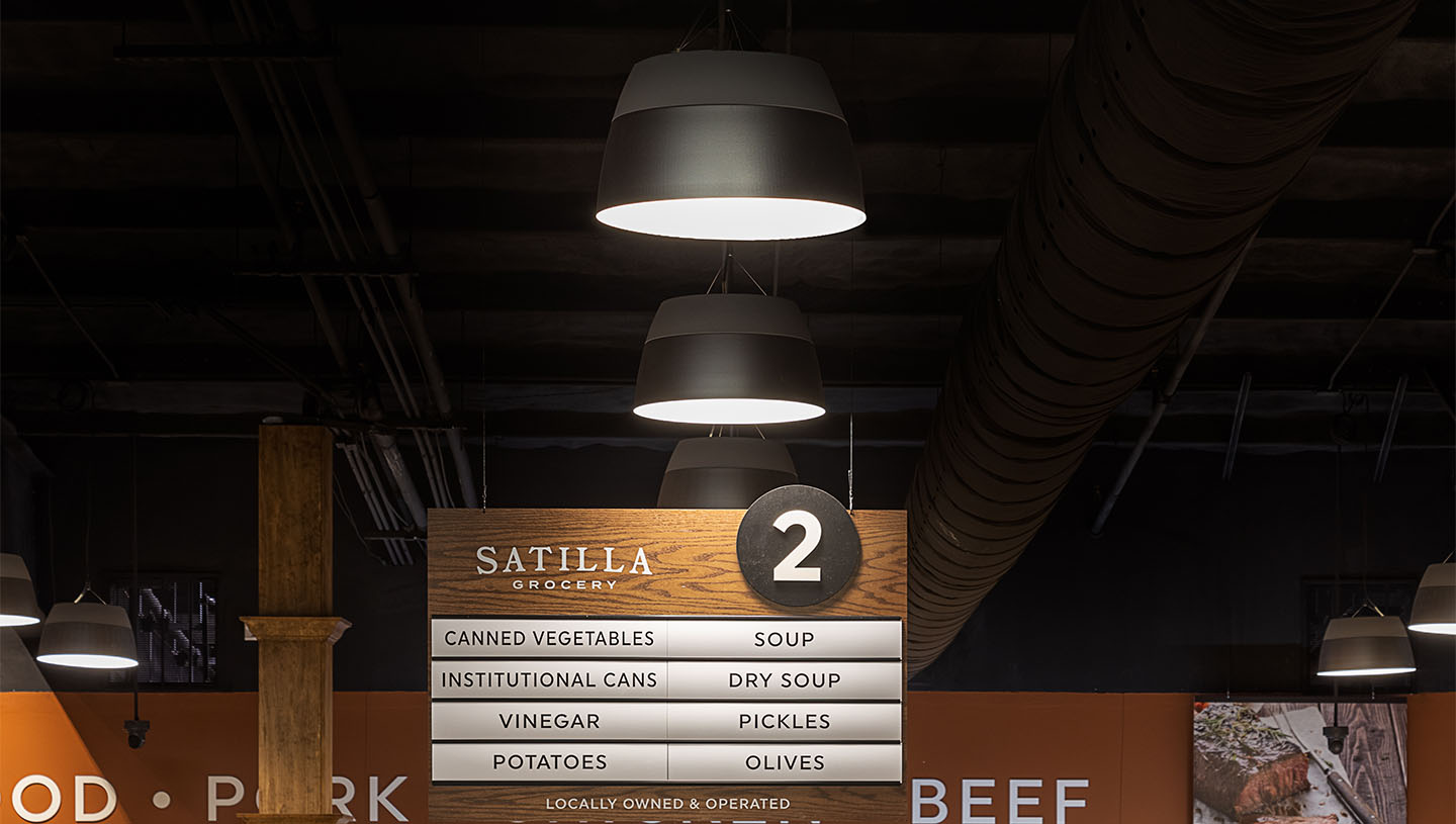 Hollowcore lighting illuminates urban grocery store signage