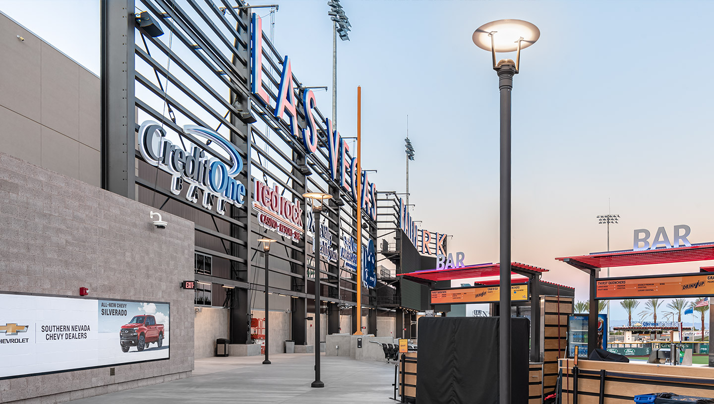 Eclipse luminaires light baseball park concourse at dusk