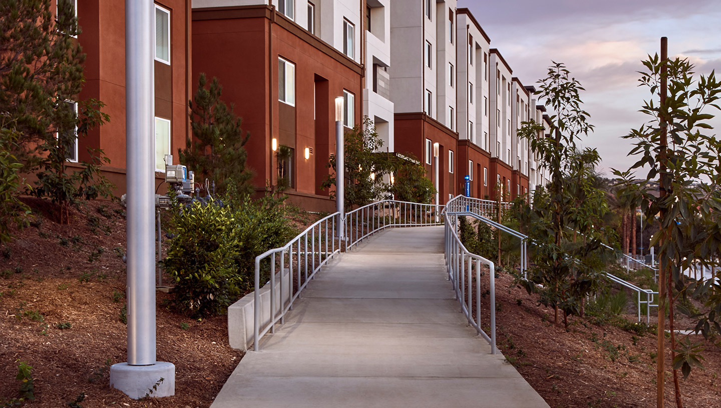 Exterior pathways of apartment complex lit by Lumistik