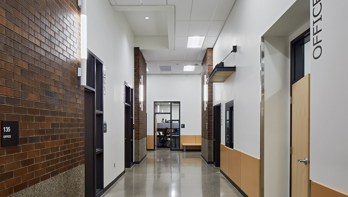 Hallway of school brightened by Lumistik wall mounted fixtures