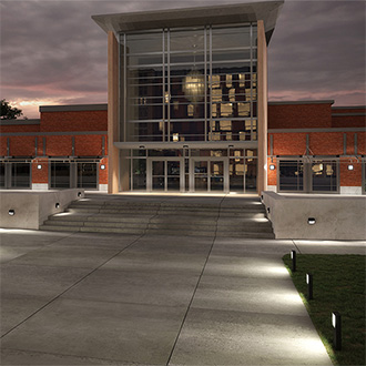 Luminaires by Scena illuminate exterior of school building